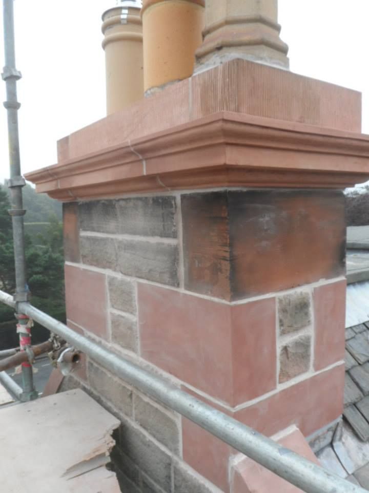 a brick chimney on a roof